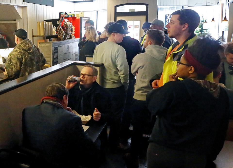 There's not much elbow room for customers during the lunch hour as downtown workers rush into Diamond Deli to order their favorite sandwiches Jan. 26 in Akron.