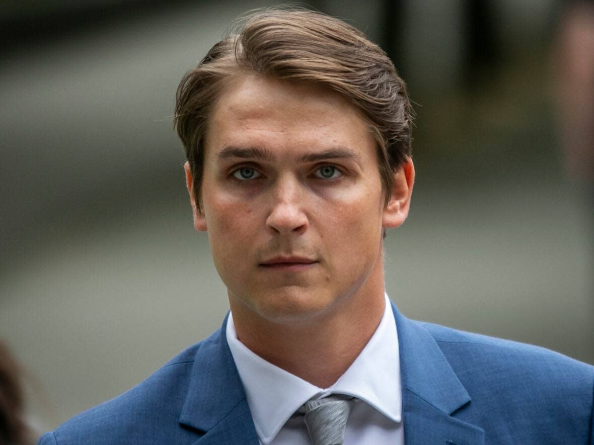 Former Vancouver Canucks hockey player Jake Virtanen is pictured walking into B.C. Supreme Court in Vancouver on the first day of his trial on one count of sexual assault.  (Ben Nelms/CBC - image credit)