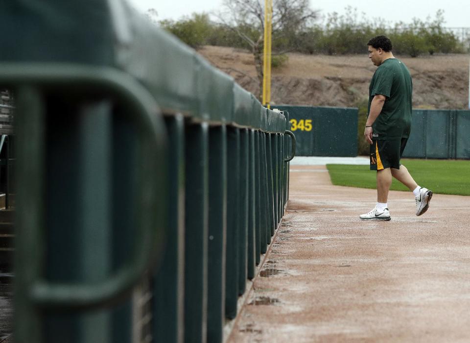 Oakland Athletics' Bartolo Colon arrives for the start of baseball spring training Monday, Feb. 11, 2013, in Phoenix. (AP Photo/Darron Cummings)