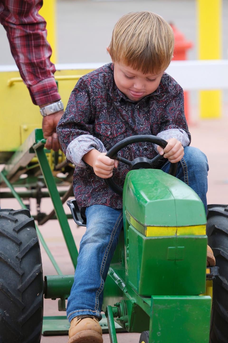 Kaden Ingram, 4, participates in the pedal tractor pull Thursday, the first day of the Oklahoma State Fair.