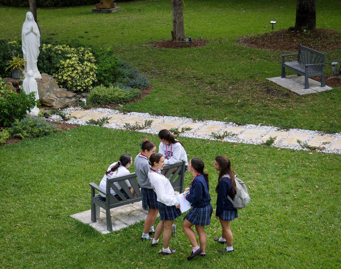 Students at Our Lady of Lourdes Catholic Academy in South Miami talk among themselves during lunch recess. While Catholic schools in South Florida have experienced a rise in enrollment in the 2023-2024 school year, Lourdes has an enrollment cap, allowing their numbers to stay the same. Carl Juste/cjuste@miamiherald.com