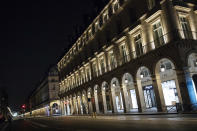 Rivoli street is empty during curfew in Paris, Saturday, Oct. 17, 2020. French restaurants, cinemas and theaters are trying to figure out how to survive a new curfew aimed at stemming the flow of record new coronavirus infections. The monthlong curfew came into effect Friday at midnight, and France is deploying 12,000 extra police to enforce it. (AP Photo/Lewis Joly)