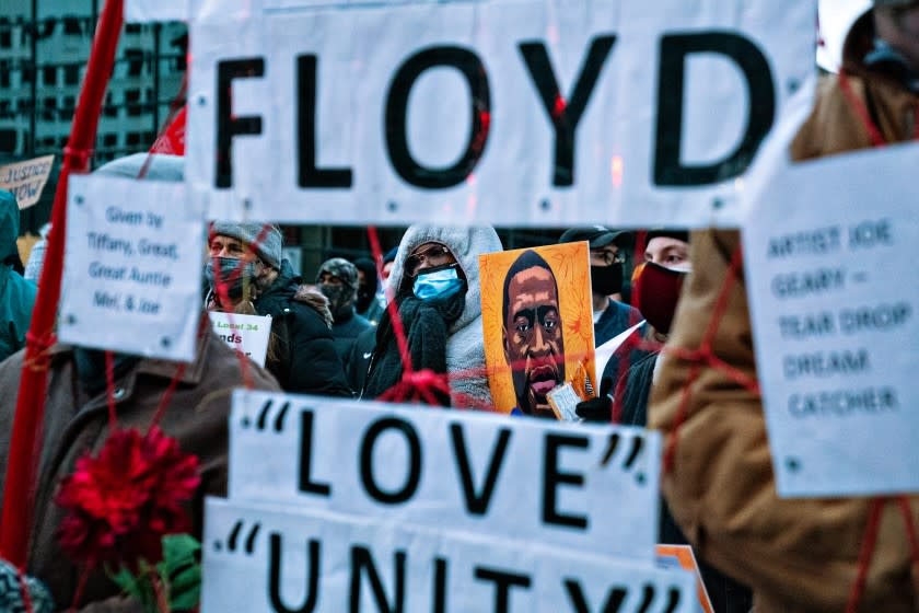 MINNEAPOLIS, MN - APRIL 19: Protesters march around downtown Minneapolis near the courthouse calling for justice for George Floyd after closing arguments in the Chauvin trial has ended on Monday, April 19, 2021 in Minneapolis, MN. (Jason Armond / Los Angeles Times)