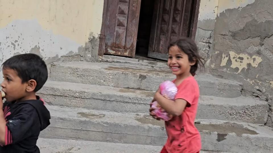 Kassem said this photo, of a young child clutching the food and wearing a grin, brought tears to his eyes.