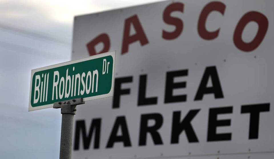 A street sign dedicated to the founder of the Pasco Flea Market, Bill Robinson, still stands near the parking entrance to the 70-acre site in east Pasco.