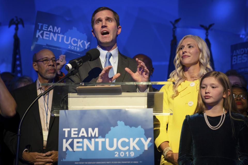 Kentucky Attorney General and democratic Gubernatorial Candidate Andy Beshear stands with his wife, Britainy as he delivers a speech at the Kentucky Democratic Party election night watch party, Tuesday, Nov. 5, 2019, in Louisville, Ky. (AP Photo/Bryan Woolston)