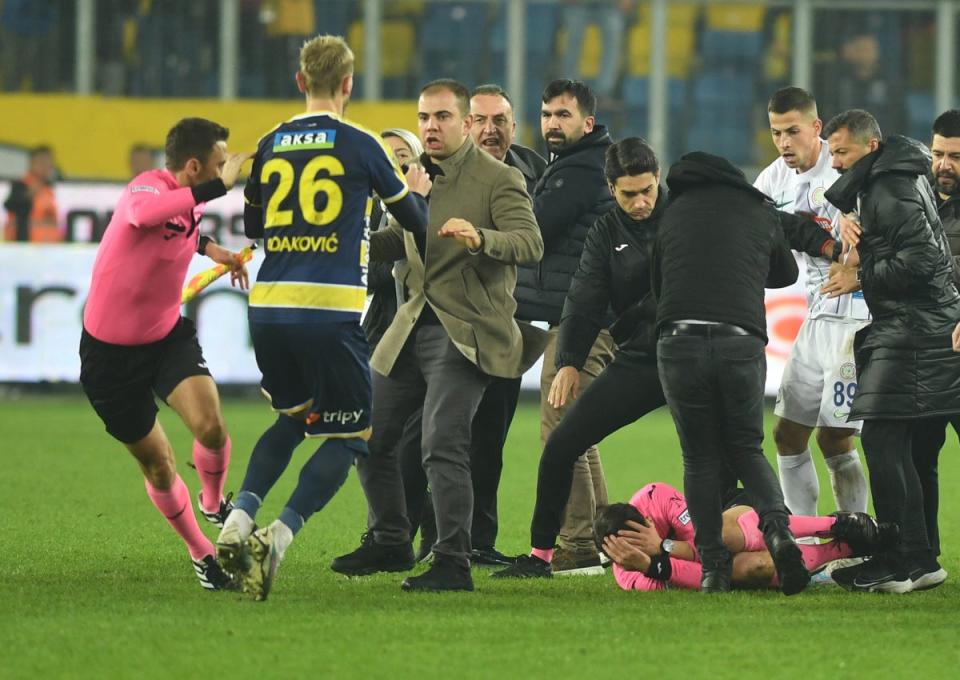 Referee Halil Umut Meler lies on the ground at the end the Turkish Super Lig soccer match between MKE Ankaragucu and Caykur Rizespor (REUTERS)