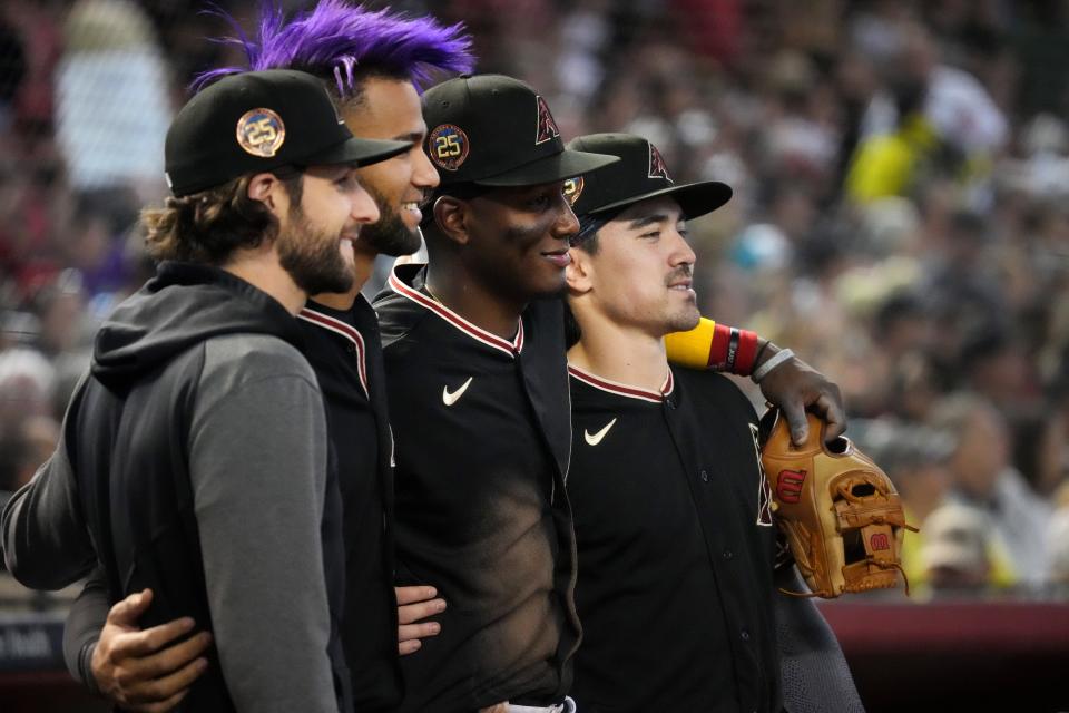 Arizona Diamondbacks players all named All-Stars Zac Gallen (23), Lourdes Gurriel Jr. (12), Geraldo Perdomo (2) and Corbin Carroll (7) pose for a photo during their game against the Pittsburgh Pirates at Chase Field in Phoenix on July 9, 2023.