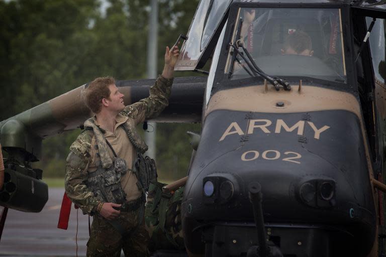 In this undated photograph received on April 18, 2015, from the Australian Defence department, Britain's Prince Harry prepares for flight at Robertson Barracks in Darwin in Australia's Northern Territory