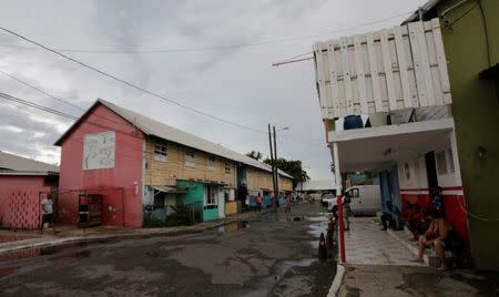 Residents are seen at Port Royal while Hurricane Matthew approaches, in Kingston, Jamaica October 2, 2016. REUTERS/Henry Romero