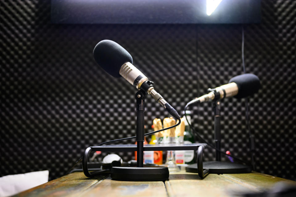 Podcast microphones stands in a recording studio on the premises of the company OMR. 