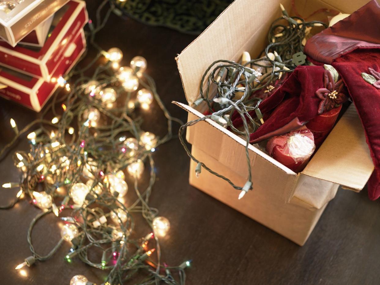 christmas lights in boxes on floor