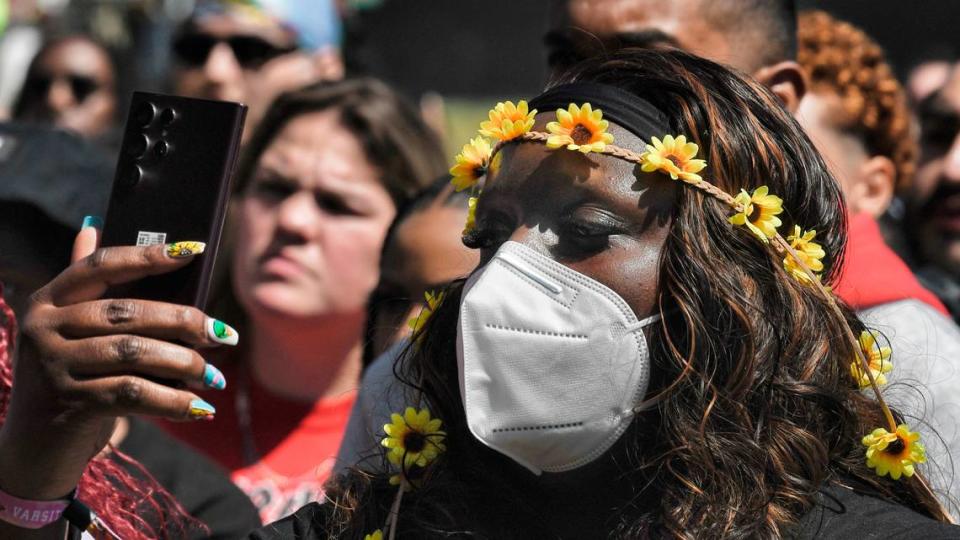 Flowers adorn the hair of a fan at the Dreamville Music Festival at Dix Park in Raleigh, N.C., Saturday, April 2, 2022.