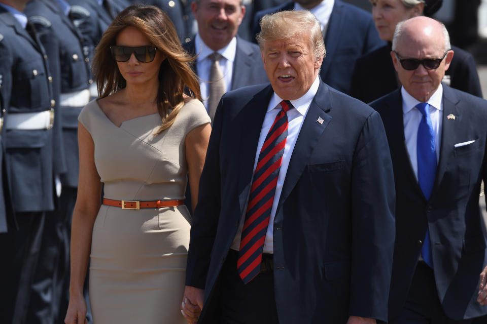 Touching down: President Trump landed at 2pm UK time on Thursday and was greeted on the tarmac by a military entourage. (Getty)