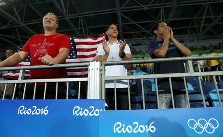 2016 Rio Olympics - Taekwondo - Preliminary - Men's -80kg Preliminary Round - Carioca Arena 3 - Rio de Janeiro, Brazil - 19/08/2016. Mark Lopez cheers on his brother Steven Lopez (USA) of USA (not pictured). REUTERS/Issei Kato