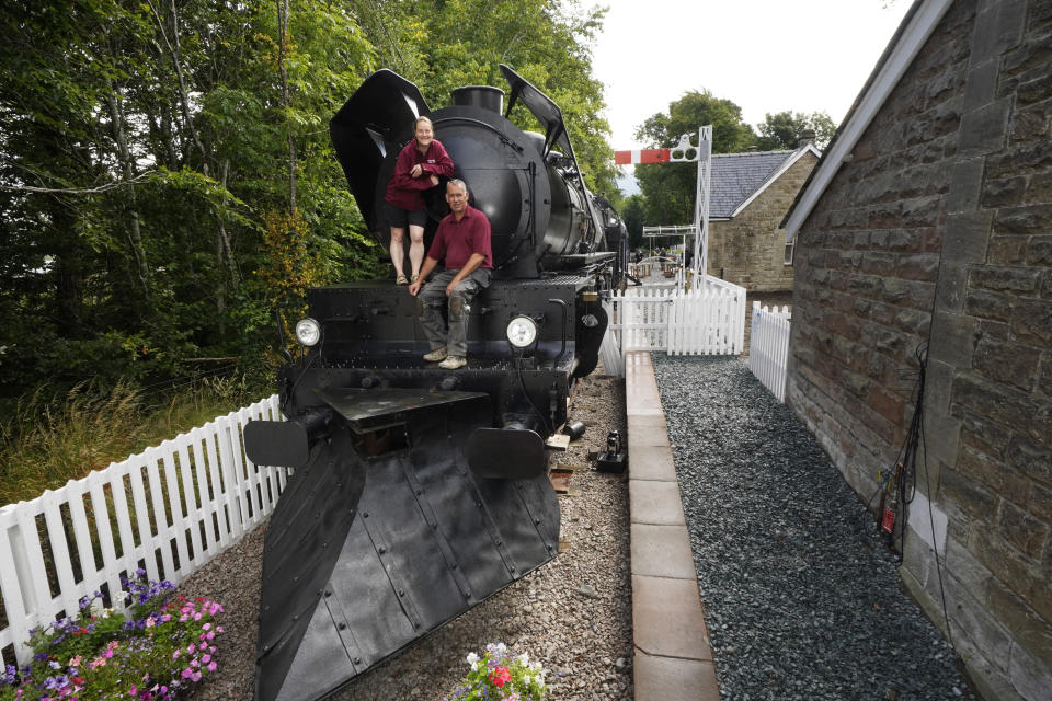 <p>Simon and Diana Parums with their full size steam train with carriages, tracks and platform as they converted and restored Bassenthwaite Lake station in Keswick, offering a dining experience on a Hollywood movie restaurant carriage as its centrepiece, when they open it to the public as an attraction. Picture date: Wednesday July 28, 2021.</p>
