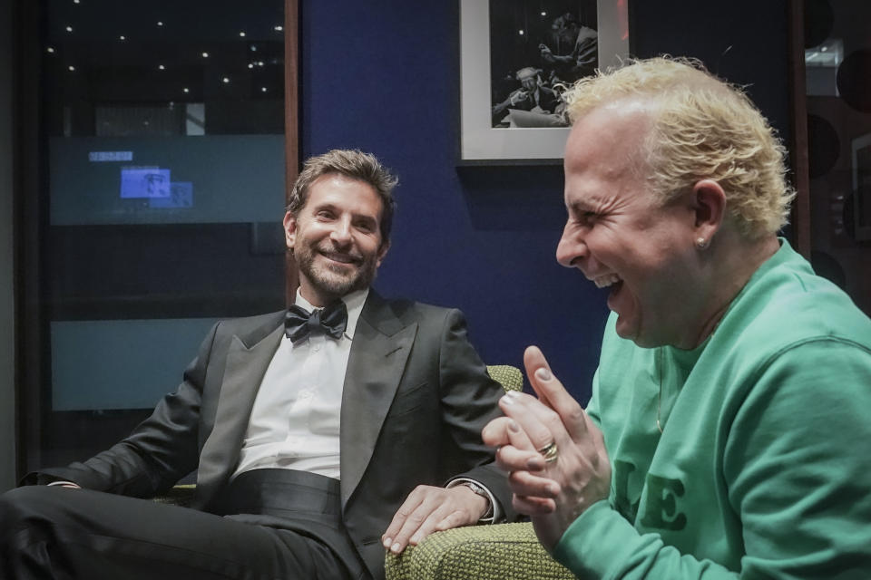 Actor and director Bradley Cooper, left, and the Metropolitan Opera's new music director Yannick Nézet-Séguin, right, speak during an interview, Wednesday, Feb. 14, 2024, in New York. (AP Photo/Bebeto Matthews)