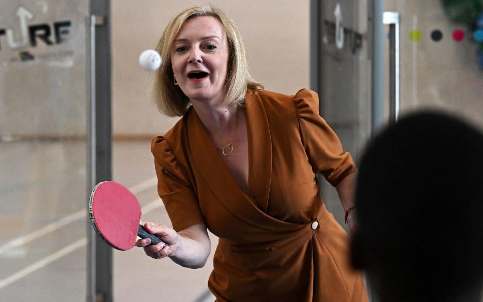 Liz Truss playing table tennis on a visit to Onside Future Youth Zone on Monday - Dylan Martinez/PA wire