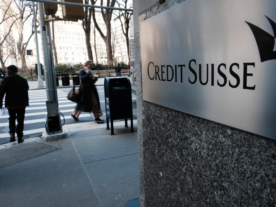 People walk by the New York headquarters of Credit Suisse on March 15, 2023 in New York City. After its largest shareholder said it could not provide further support, Credit Suisse shares fell by as much as 30% on Wednesday as global concerns over the stability of major banks continued to spread.