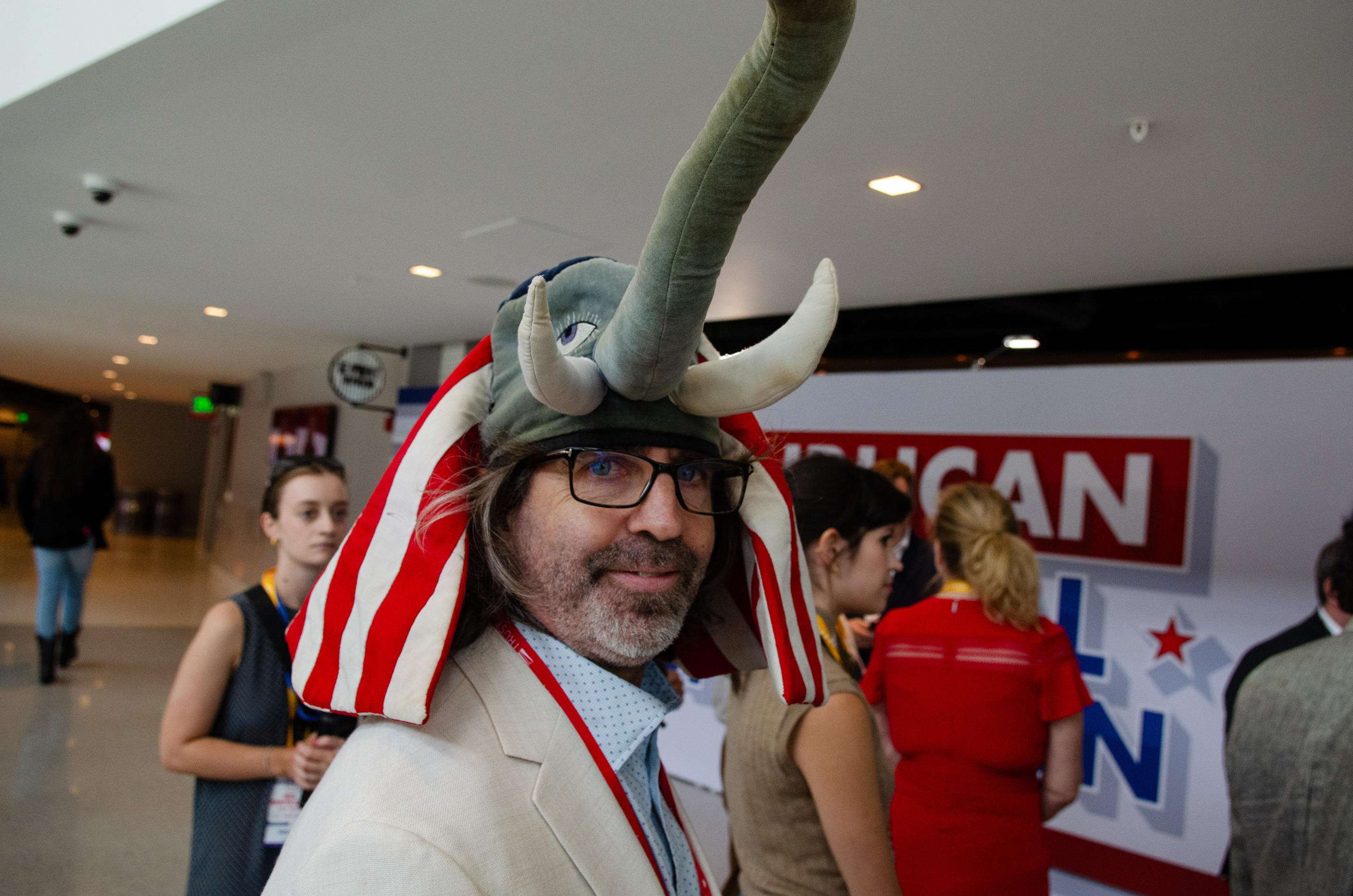 A man wearing an elephant hat arrives at the convention on Monday. 