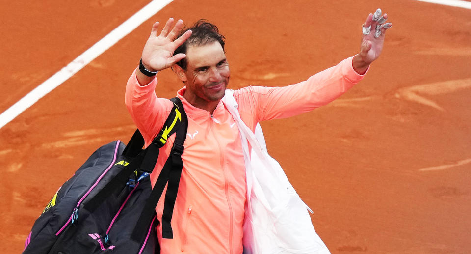 Rafa Nadal waves to fans after crashing out of the Barcelona Open at the hands of Alex de Minaur. Pic: Getty