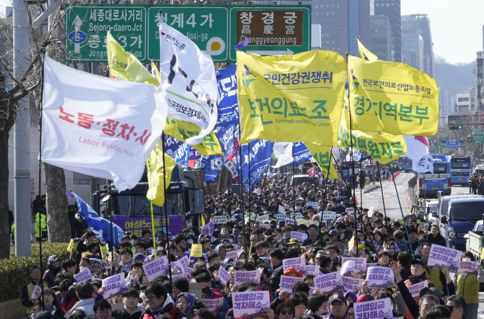 Members of the Korean Confederation of Trade Unions march during a rally marking International Women's Day in Seoul, South Korea, Friday, March 8, 2024. (AP Photo/Ahn Young-joon)