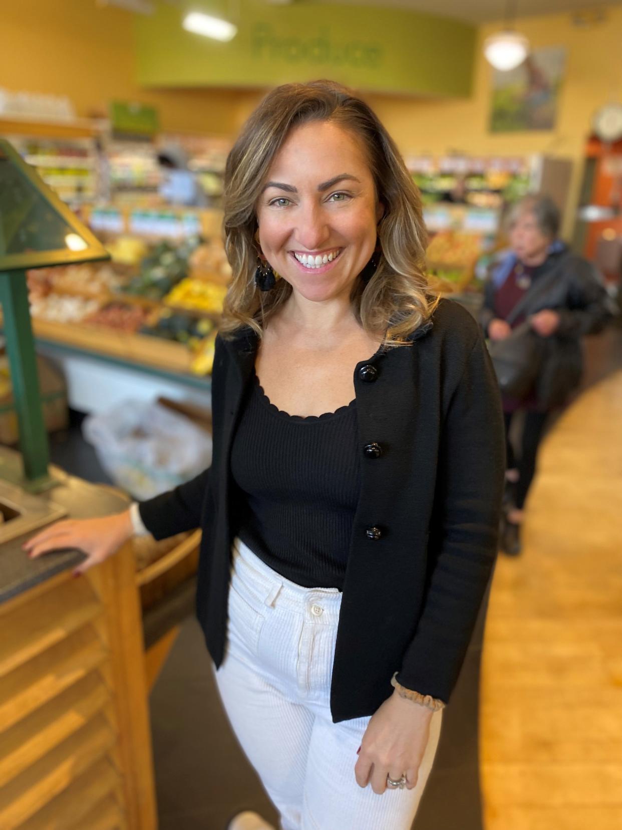 Rainbow Blossom second-generation owner Summer Auerbach stands inside one of the natural foods and wellness company's Louisville area locations.