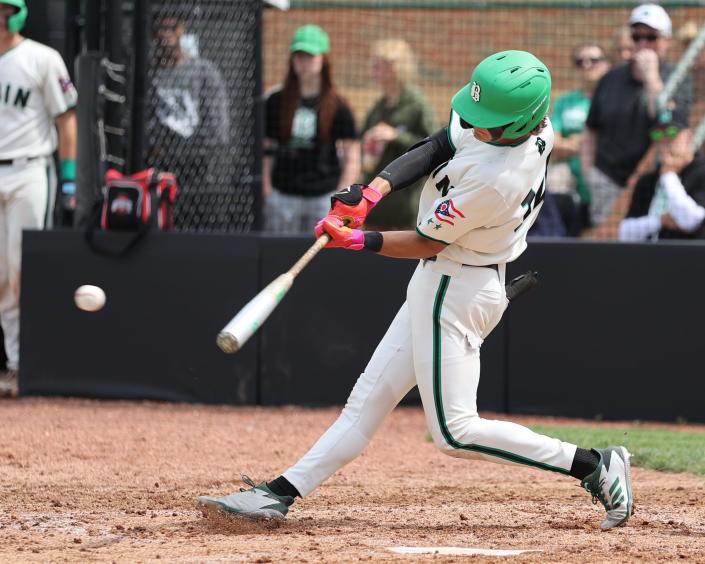 Badin shortstop Landyn Vidourek gets an RBI base hit in the game between Badin and Taylor high schools at Mason High School, June 2, 2022.