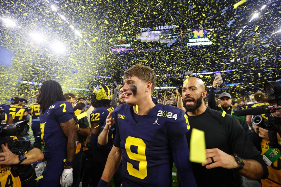 Michigan Wolverines quarterback J.J. McCarthy celebrates after winning the 2024 College Football Playoff national championship game with a 34-13 victory over the Washington Huskies in Houston.