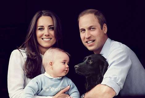 The Duchess and Duke of Cambridge at Kensington Palace with the eight-month-old Prince George and their cocker spaniel, Lupo.