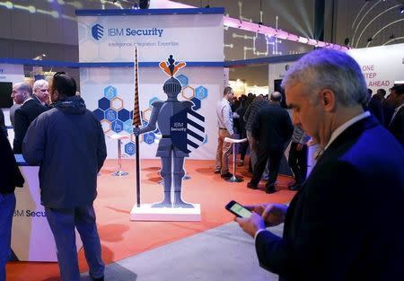 Attendees gather next to the exhibit stall of IBM Security at the Cybertech 2016 conference in Tel Aviv, Israel January 26, 2016. REUTERS/Baz Ratner