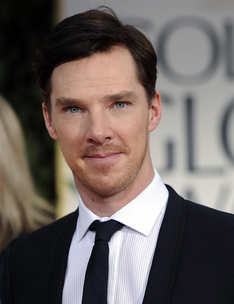 FILE - In this Sunday, Jan. 15, 2012, file photo Benedict Cumberbatch arrives on the red carpet before the 69th Annual Golden Globe Awards, in Los Angeles. For the past three decades, many Britons had hoped the rigid class system that defined their country from Dickens to “Downton Abbey” was finally dying. Now they fear that class, their old bugbear, is back on the rise. A recent Sunday Telegraph story with the headline "young, gifted and posh" said Britain's oldest private schools, such as all-male Eton and Harrow, had become a "production line of young talent," including "Homeland" star Damian Lewis, Benedict Cumberbatch of "Sherlock" and Dominic West of “The Wire.” (AP Photo/Chris Pizzello, File)