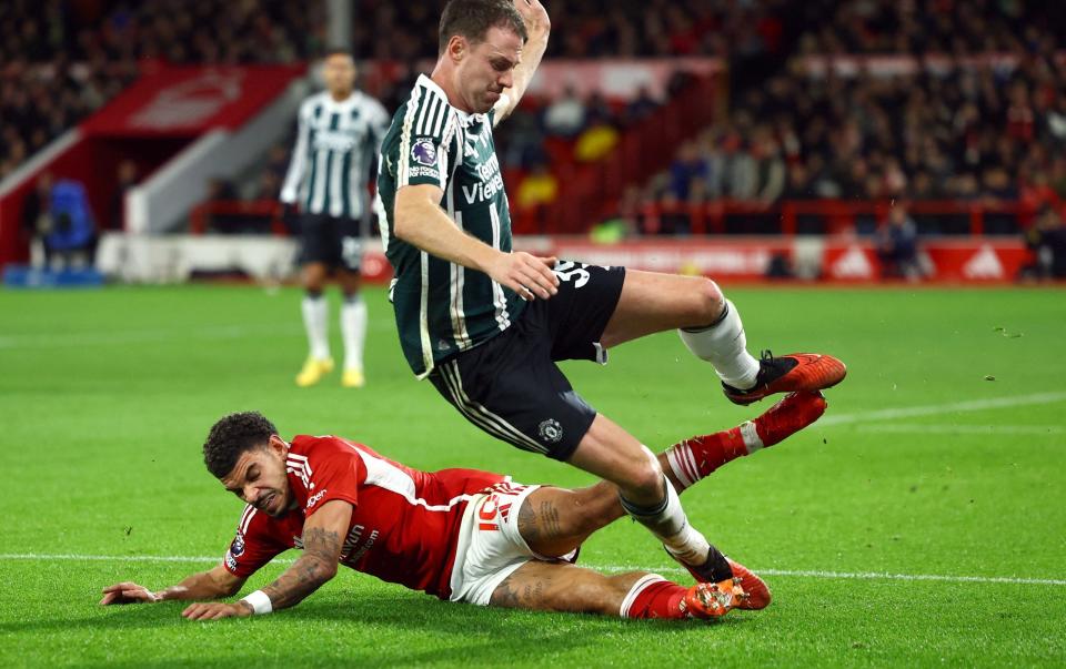 Nottingham Forest's Morgan Gibbs-White in action with Manchester United's Jonny Evans