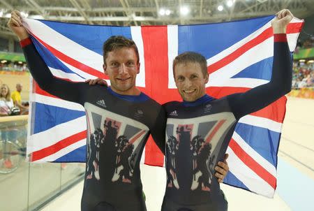 2016 Rio Olympics - Cycling Track - Final - Men's Sprint Final Gold Race - Rio Olympic Velodrome - Rio de Janeiro, Brazil - 14/08/2016. Gold medalist Jason Kenny (GBR) of Britain poses with silver medalist Callum Skinner (GBR) of Britain. REUTERS/Matthew Childs