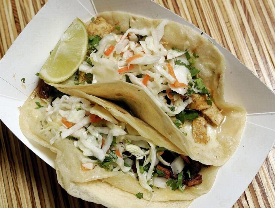 Chicken and pastor “El Capitan”-style tacos from Salsa Limon, shown in a file photo.