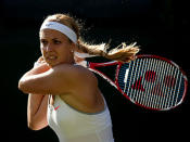 Sabine Lisicki of Germany plays a backhand during the Ladies' Singles third round match against Samantha Stosur of Australia on day six of the Wimbledon Lawn Tennis Championships at the All England Lawn Tennis and Croquet Club on June 29, 2013 in London, England.