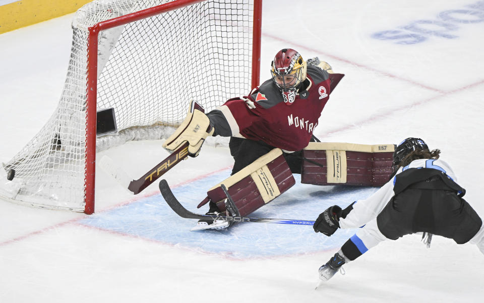 Toronto's Maggie Connors (22) shoots the puck wide of Montreal goaltender Ann-Renee Desbiens during the second period of a PWHL hockey game at the Bell Centre in Montreal, Saturday, April 20, 2024.(Graham Hughes/The Canadian Press via AP)