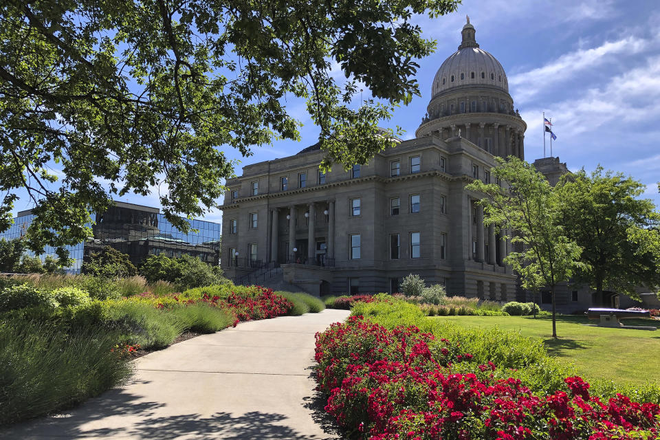 FILE - The Idaho State Capitol in Boise, Idaho, is seen on June 13, 2019. An Idaho woman says her lawsuit challenging the state's ban on transgender athletes should continue moving through the court system because she is enrolled as a student at Boise State University and plans to play soccer on the school's club team next spring. Idaho passed the nation's first transgender sports ban last year, barring transgender women from playing on women's sports teams sponsored by public schools, colleges and universities. The law, dubbed House Bill 500 in court filings, doesn't affect transgender men playing on men's sports teams. (AP Photo/Keith Ridler, File)