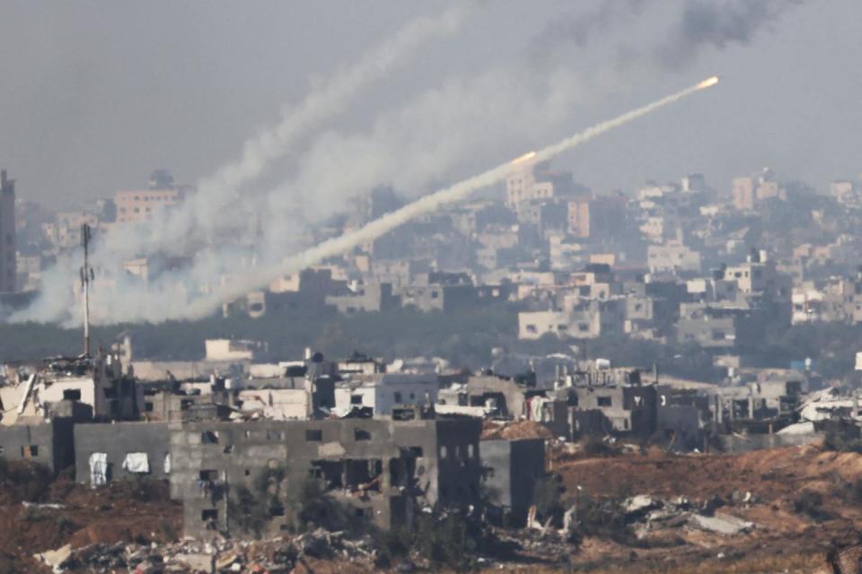 Rockets are fired from inside Gaza toward Israel. <a href="https://www.gettyimages.com/detail/news-photo/this-picture-taken-from-southern-israel-near-the-border-news-photo/1814573875" rel="nofollow noopener" target="_blank" data-ylk="slk:Jack Guez/AFP via Getty Images;elm:context_link;itc:0;sec:content-canvas" class="link ">Jack Guez/AFP via Getty Images</a>
