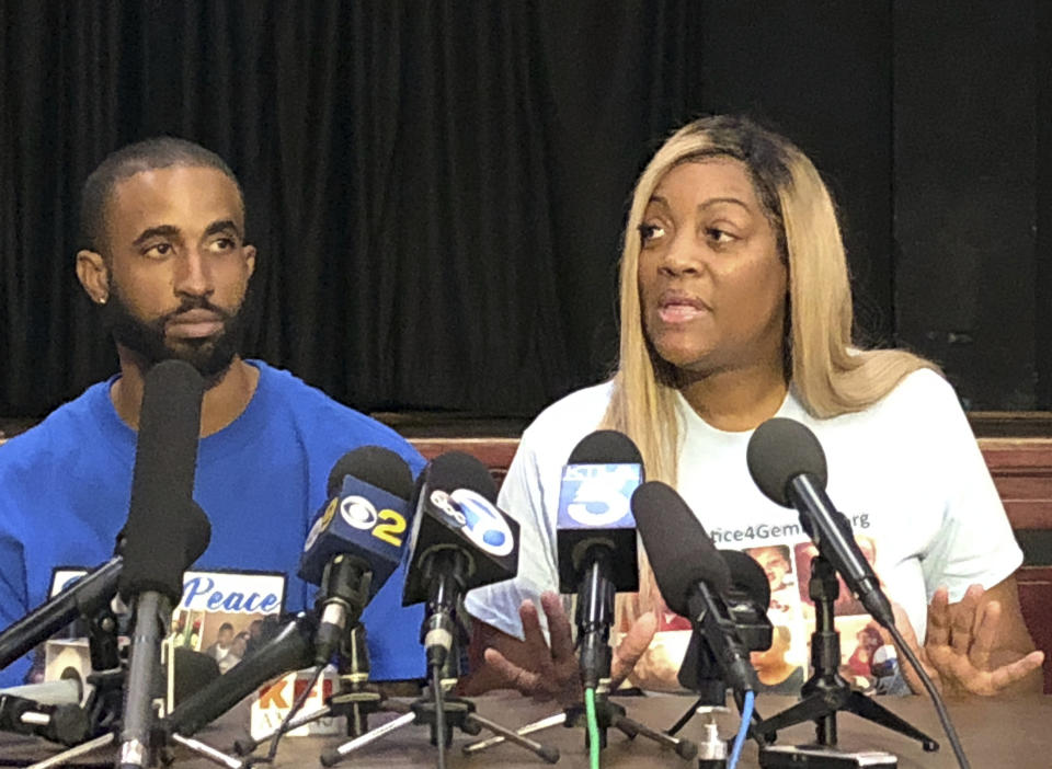 In this Sept. 25, 2019 photo, LaTisha Nixon, second from right, talks about her son Gemmel Moore, one of the men who died in the apartment of Democratic donor Edward Buck, with Gemmel's friend Cory McLean, left, at a news conference in West Hollywood, Calif. At left is Gemmel's friend Cory McLean. It took more than two years from the first overdose death in political donor Ed Buck's apartment until his arrest this month. In the time in between, another man died in the West Hollywood home, another had a close brush with death and several others reporting harrowing encounters with the gay white man who preyed on young black men to satisfy a drug-fueled sexual fetish. Activists who pushed for Buck's arrest wonder why it took so long to lock him up. (AP Photo/Brian Melley)