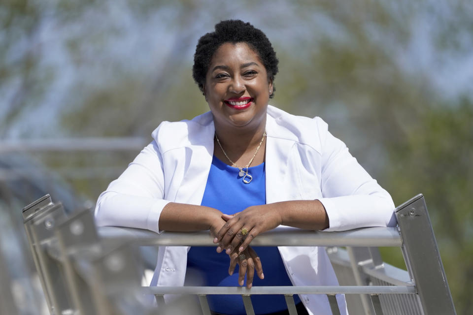 Dr. Brandi Jackson poses for a portrait in the Bronzeville neighborhood of Chicago, Sunday, May 2, 2021. Jackson and her twin, Dr. Brittani James, have taken on the medical establishment in pioneering work to eliminate racism in medicine. (AP Photo/Charles Rex Arbogast)