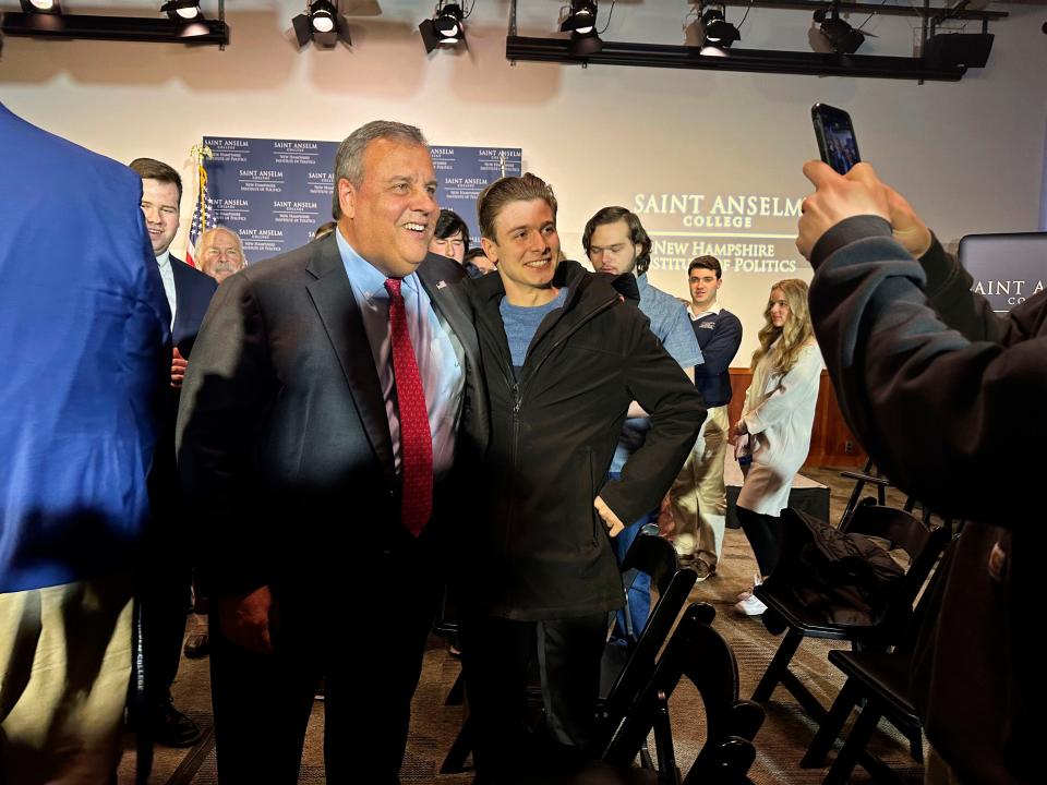 Former New Jersey Gov. Chris Christie greets voters and students at the New Hampshire Institute of Politics at Saint Anselm College in Manchester, N.H., on Monday.