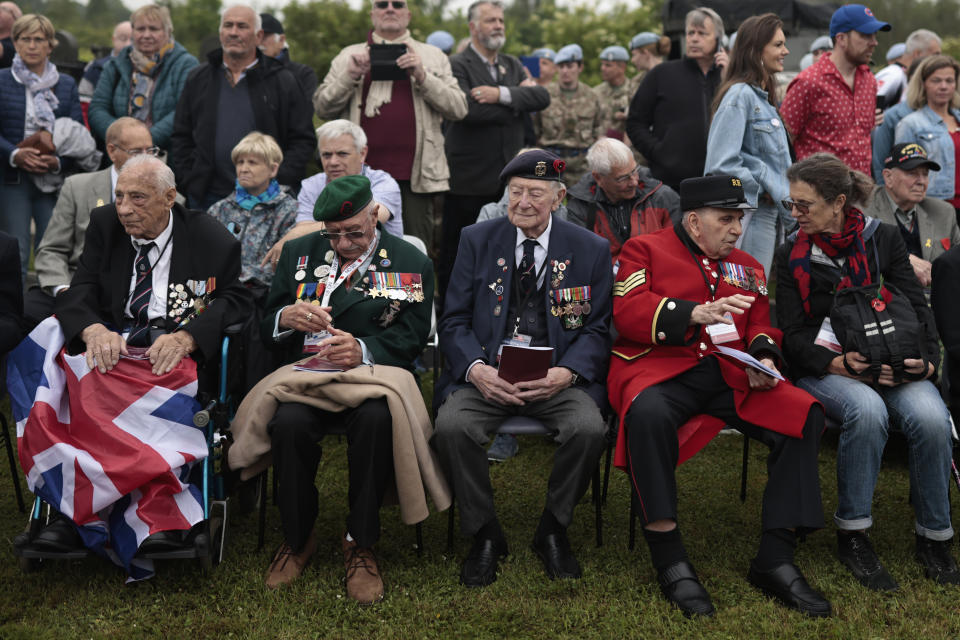 British Veterans attend the ceremony at Pegasus Bridge, in Ranville, Normandy, Sunday, June, 5, 2022. On Monday, the Normandy American Cemetery and Memorial, home to the gravesites of 9,386 who died fighting on D-Day and in the operations that followed, will host U.S. veterans and thousands of visitors in its first major public ceremony since 2019. (AP Photo/Jeremias Gonzalez)