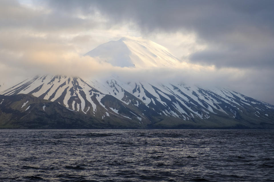 In this photo provided by the Alaska Volcano Observatory/U.S. Geological Survey is the Tanaga Volcano near Adak, Alaska, on May 23, 2021. A swarm of earthquakes occurring over the past few weeks has intensified at a remote Alaska volcano dormant for over a century, a possible indication of an impending eruption. The Alaska Volcano Observatory raised the alert level to advisory status for Tanaga Volcano late Tuesday, March 7, 2023, after the quakes became very vigorous. (Matt Loewen/Alaska Volcano Observatory/U.S. Geological Survey via AP)