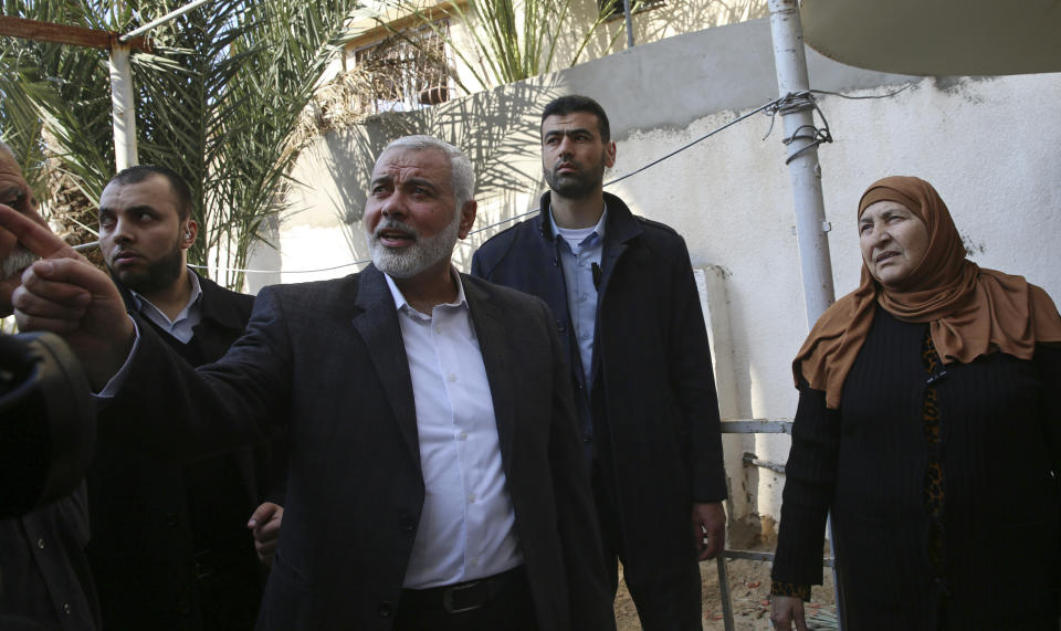 Hamas' supreme leader Ismail Haniyeh tours the site of a destroyed building, in Gaza City, Wednesday, March 27, 2019. Haniyeh made his first public appearance since a new round of cross-border violence with Israel this week. On Wednesday he visited the rubble of his Gaza City office, which was destroyed in an Israeli airstrike. (AP Photo/Adel Hana)