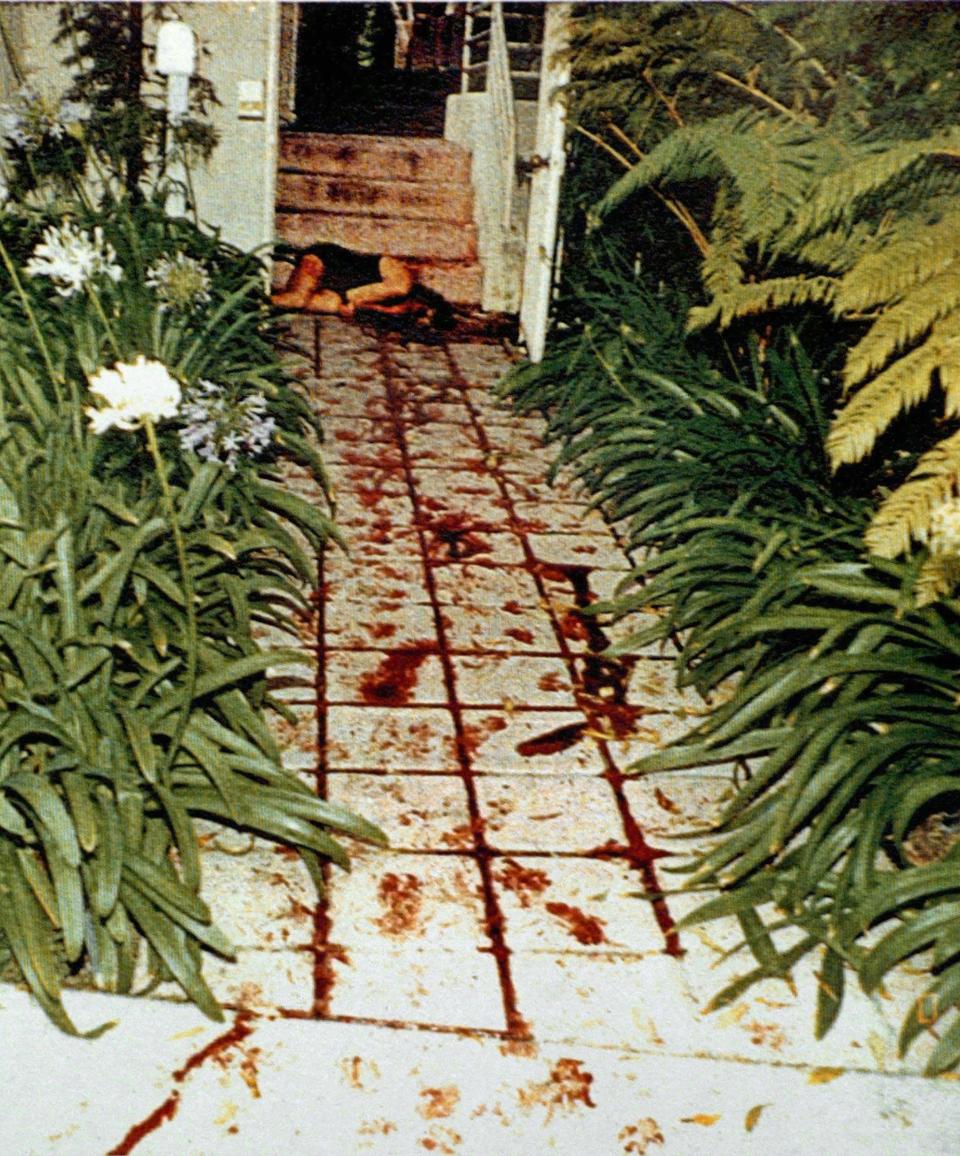 EDITORS NOTE: GRAPHIC CONTENT - In this file photo provided Friday, Oct. 25, 1996, by the Los Angeles Police Department/Los Angeles Superior Court shows the body of Nicole Brown Simpson, where she was found on the bloodstained walkway of her Bundy Drive condominium, an LAPD evidence image used in the O.J. Simpson civil trial in Superior Court in Santa Monica, Calif. (Los Angeles Police Department/Los Angeles Superior Court via AP, File)