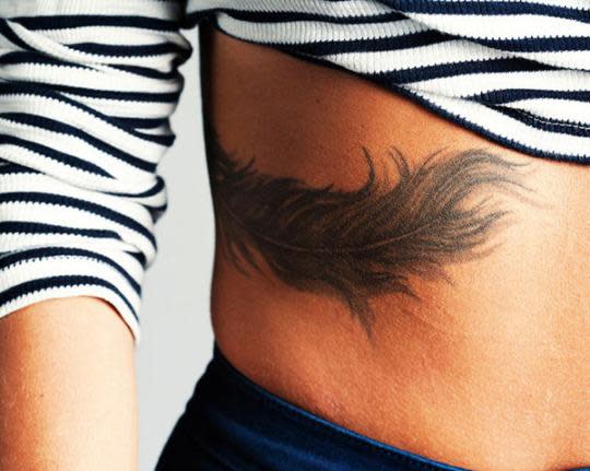 feather tattoos on hip