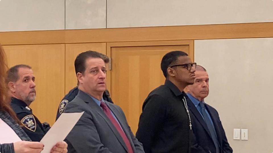 Jason Ricketts, in glasses, stands between his lawyers, Richard Ferrante, left, and Russell Smith, April 4, 2024, as he is sentenced to 21 years in state prison for sexually abusing three boys over a four year period in New Rochelle