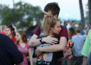 <p>Students embrace during a vigil held at the Texas First Bank after a shooting left several people dead at Santa Fe High School in Santa Fe, Texas, May 18, 2018. (Photo: Trish Badger/Reuters) </p>