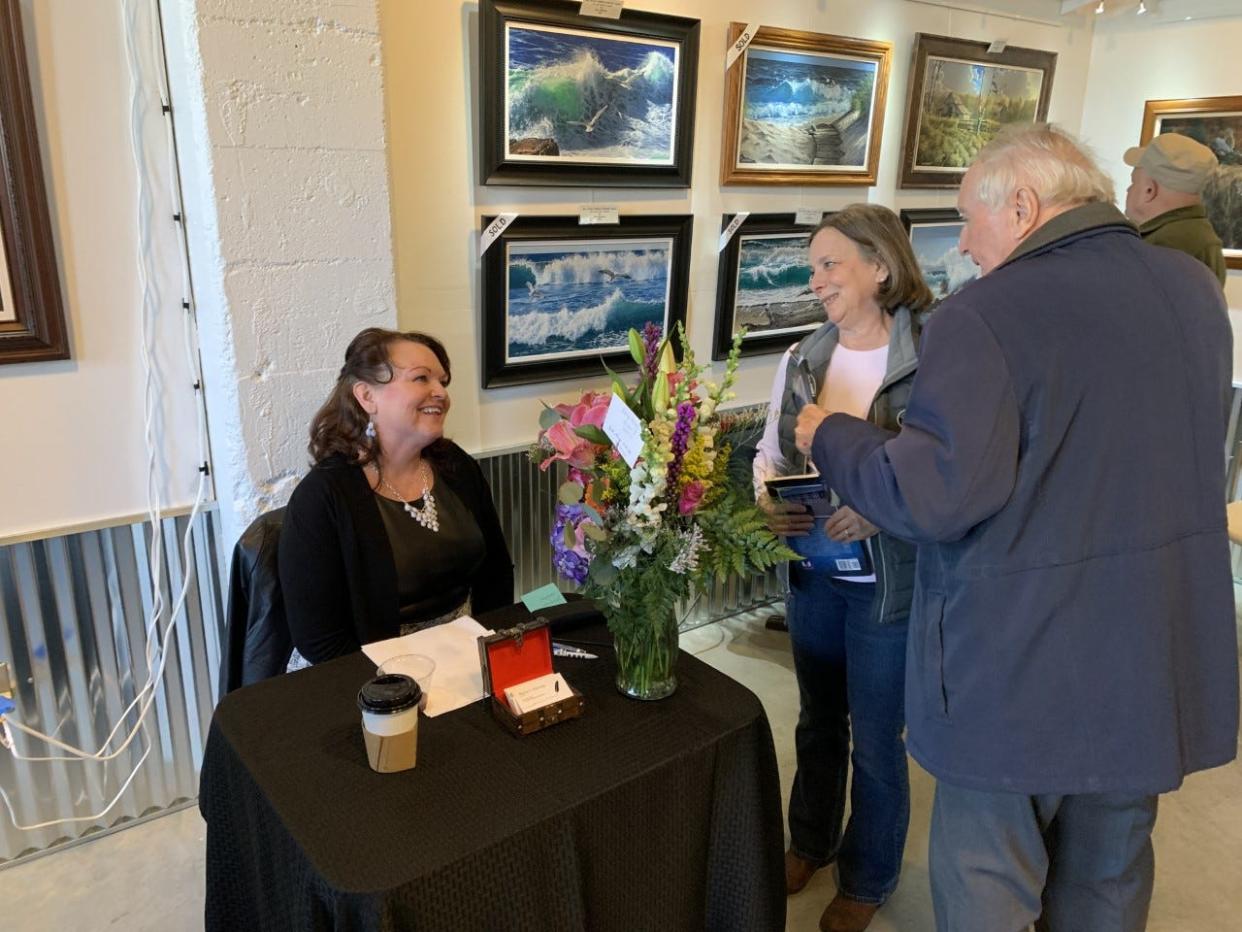 Nancy Hastings signing books on Saturday